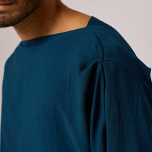Load image into Gallery viewer, ZERØ London - Close up, mens zero waste long sleeve high/low shirt with bateau neck in teal blue, designed &amp; made in London
