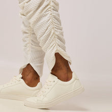 Load image into Gallery viewer, ZERØ London - Close up view. Mens zero waste tapered trouser with gathers in white. Designed &amp; made in London
