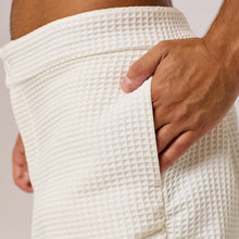 Load image into Gallery viewer, ZERØ London - Close up view. Mens zero waste tapered trouser with gathers in white. Designed &amp; made in London
