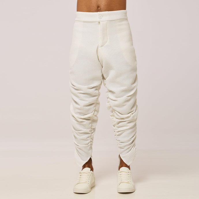 ZERØ London - Front mid-length view. Mens zero waste tapered trouser with gathers in white. Designed & made in London