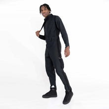 Load image into Gallery viewer, ZERØ London - Side full length view, mens zero waste jumpsuit in black with black contrast stripe and D-rings, designed &amp; made in London
