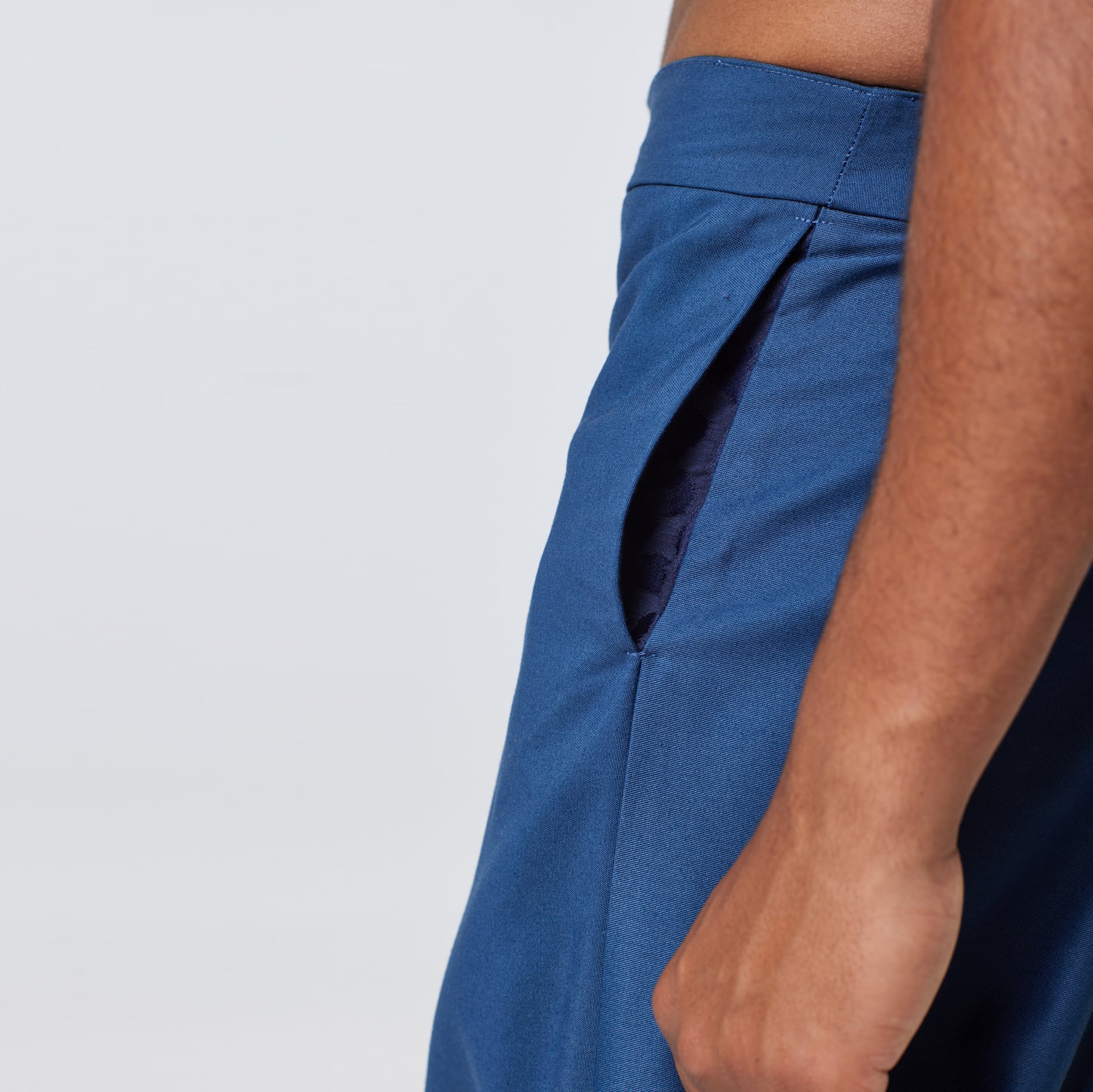 ZERØ London - Close up, mens premium pleated blue trouser, zero waste fashion, designed & made in London