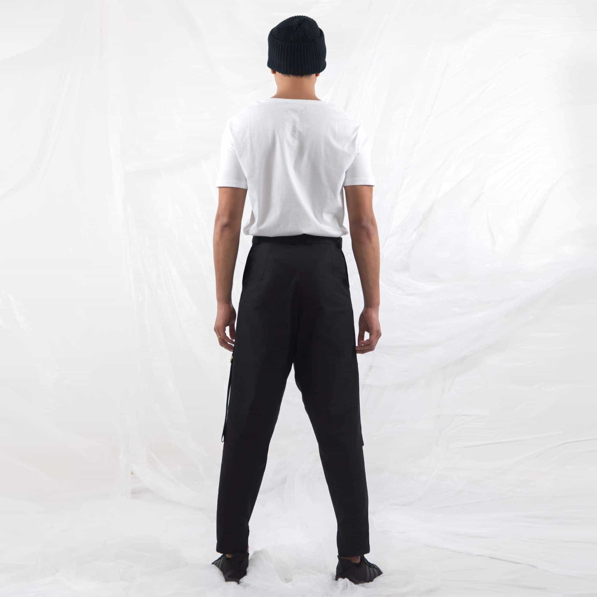   ZERØ London - Close up,  mens black zero waste trousers with gold d rings and contrast stripe designed & made in London