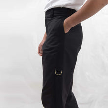 Load image into Gallery viewer,   ZERØ London - Close up, mens black zero waste trousers with gold d rings and contrast stripe designed &amp; made in London
