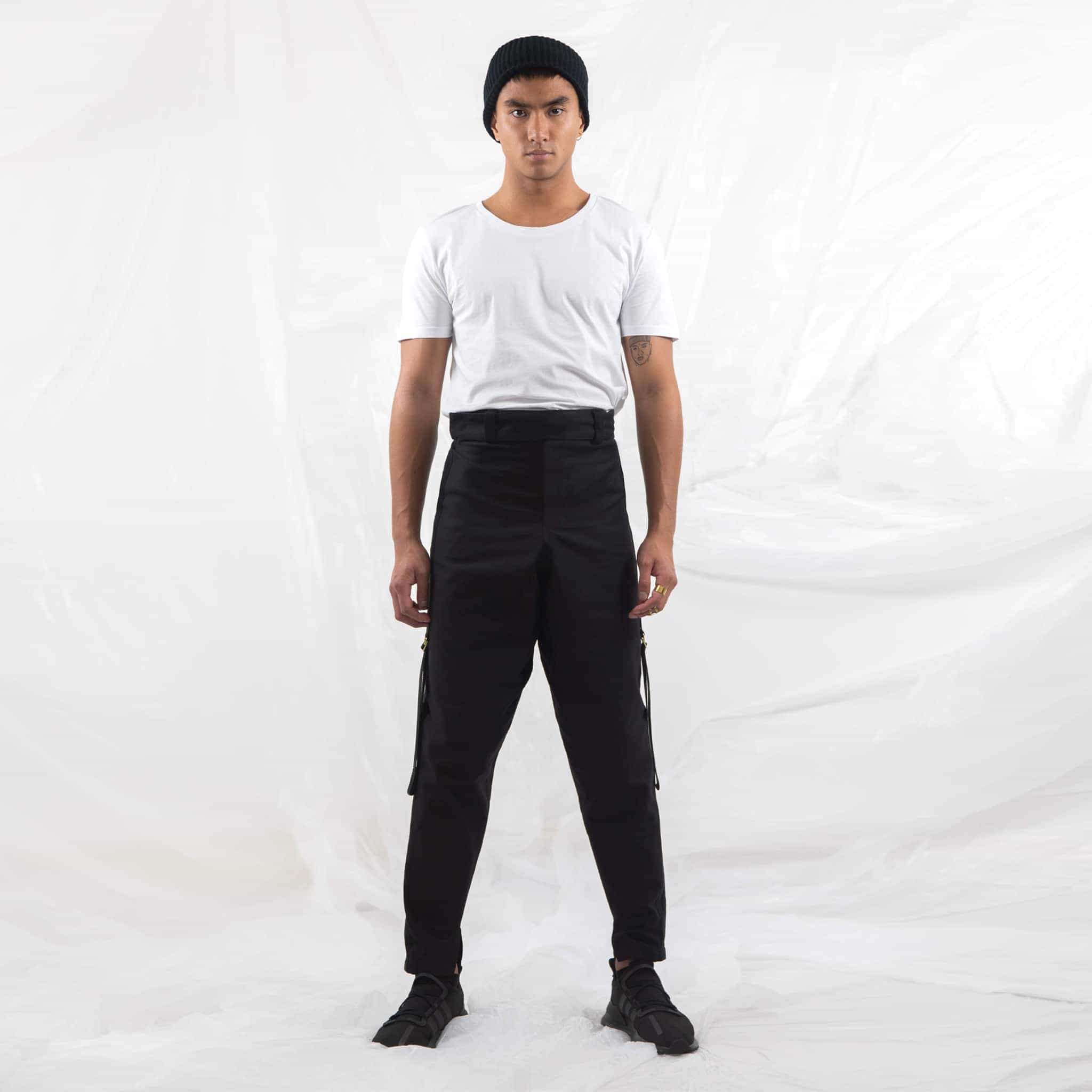  ZERØ London - Front full length view,  mens black zero waste trousers with gold d rings and contrast stripe designed & made in London