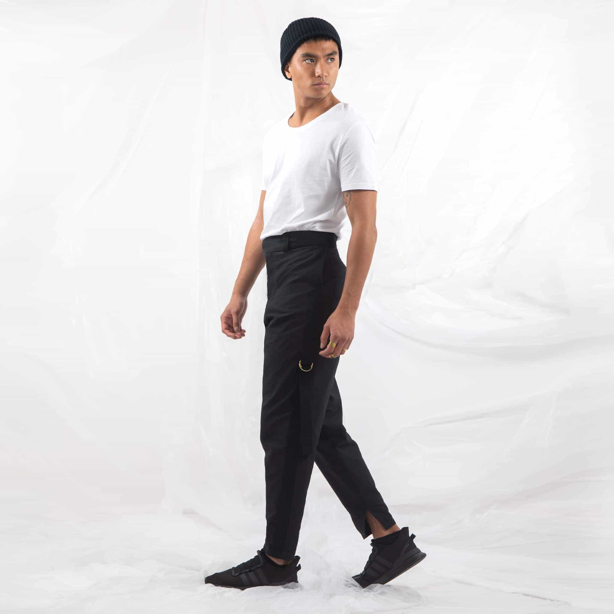   ZERØ London - Side alt. full length view,  mens black zero waste trousers with gold d rings and contrast stripe designed & made in London