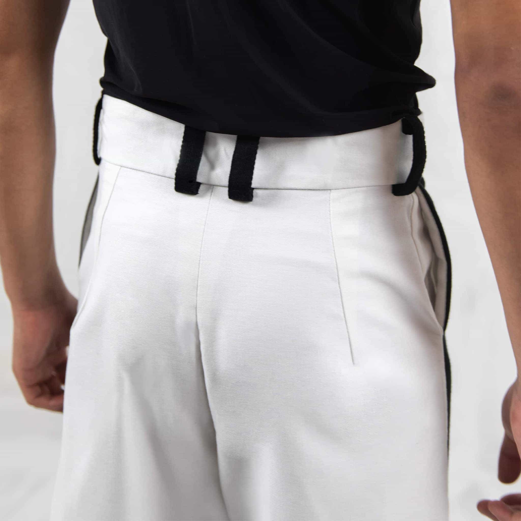 ZERØ London - Alt. close up, mens white zero waste trousers with gold d rings and contrast stripe designed & made in London