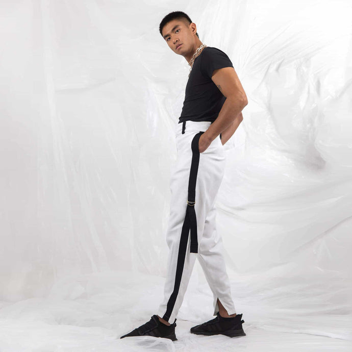   ZERØ London - Side full length view,  mens white zero waste trousers with gold d rings and contrast stripe designed & made in London